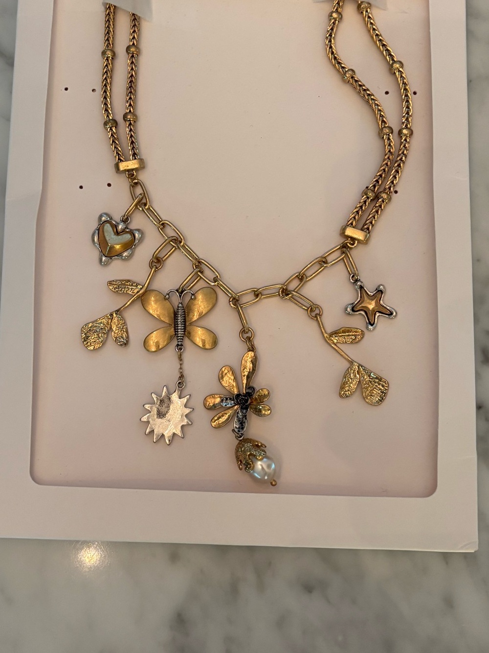 NWT gold tone charm necklace with double chain butterflies, hearts and flowers
